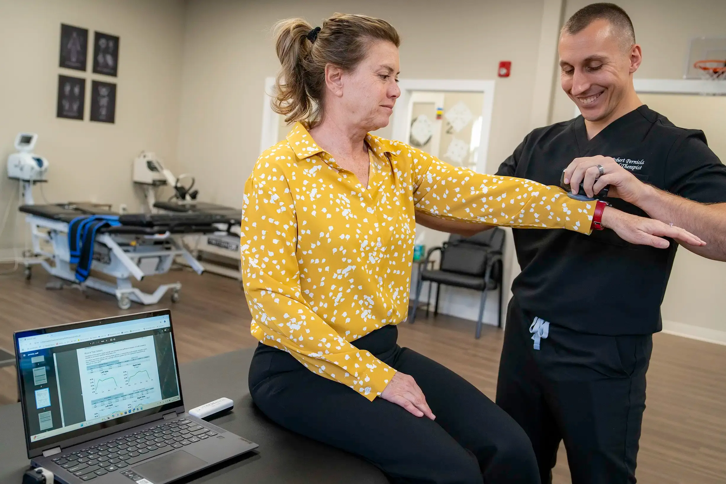 Physical therapist guiding a patient through core stabilization exercises for degenerative disc disease in Morganville, NJ