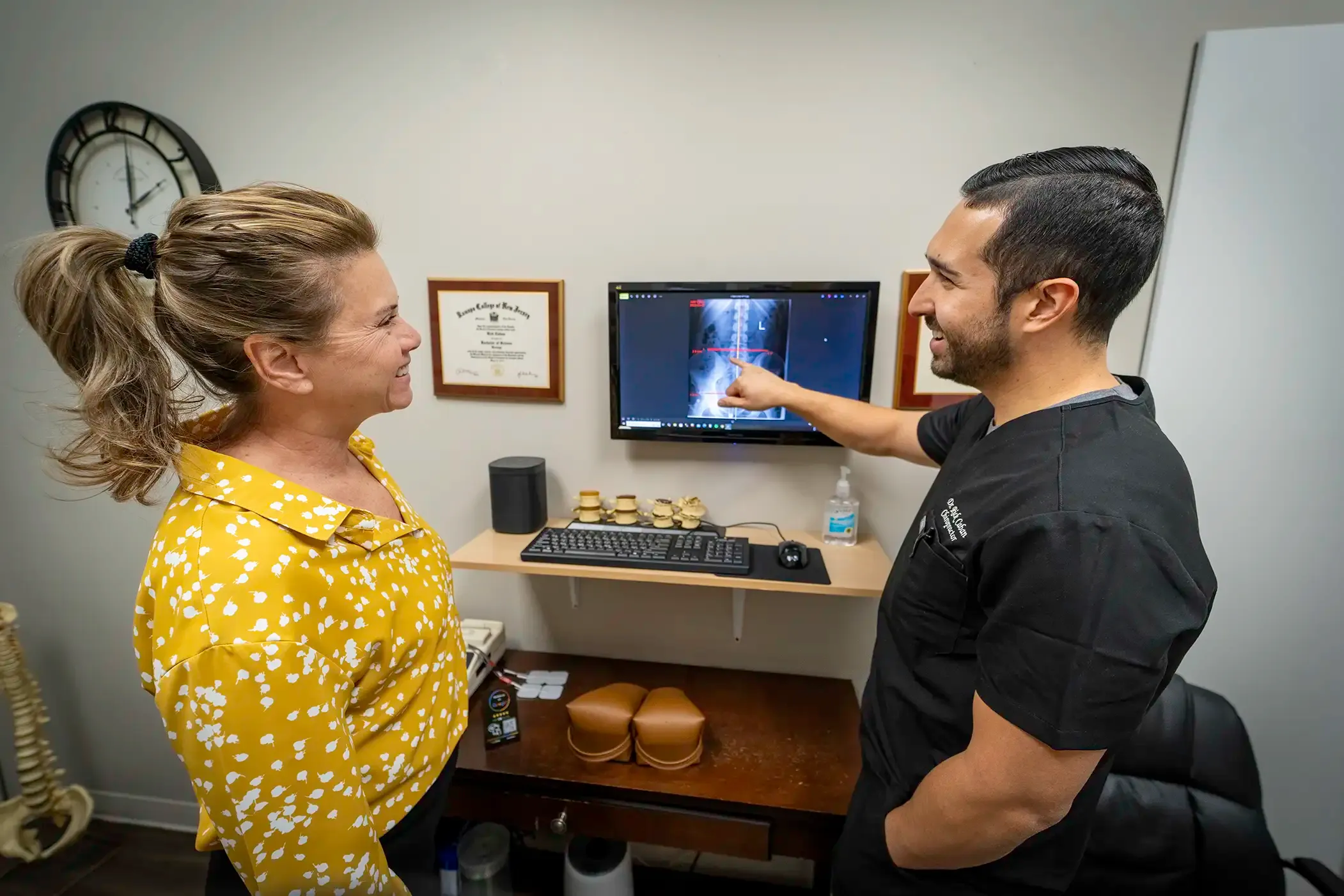 Chiropractor performing a gentle spinal adjustment